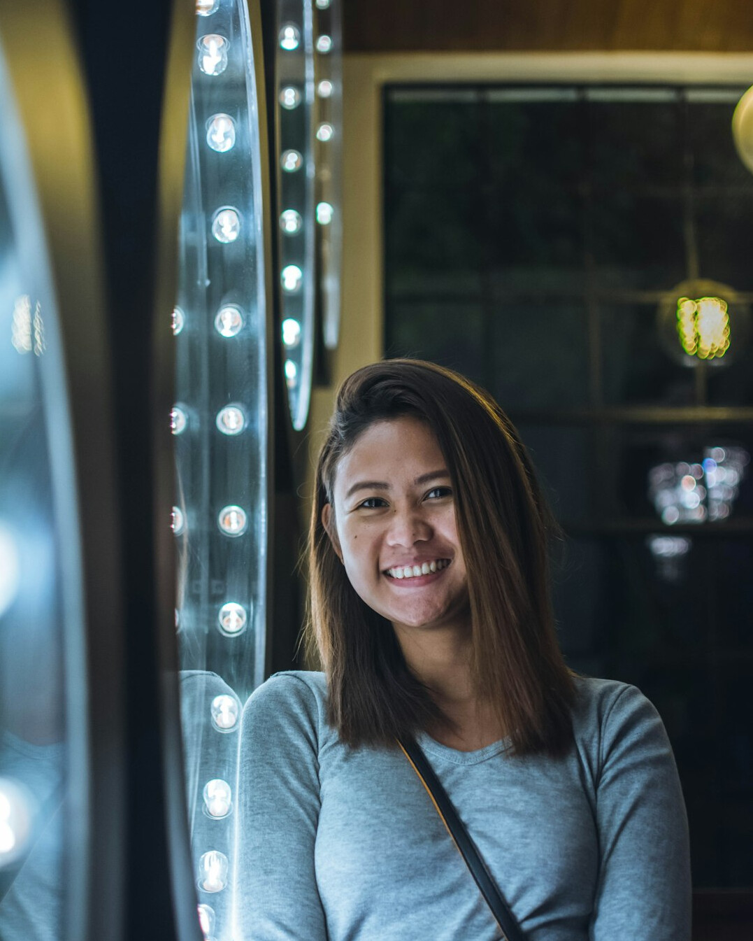woman smiling confidently in mirror