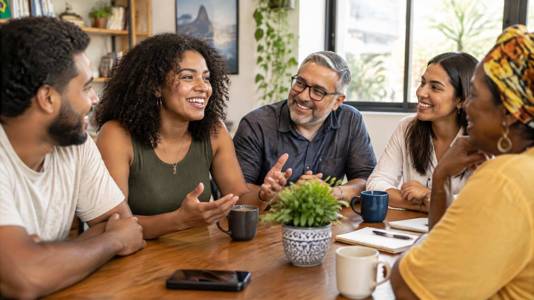 Diverse group of people having an engaged conversation around a table