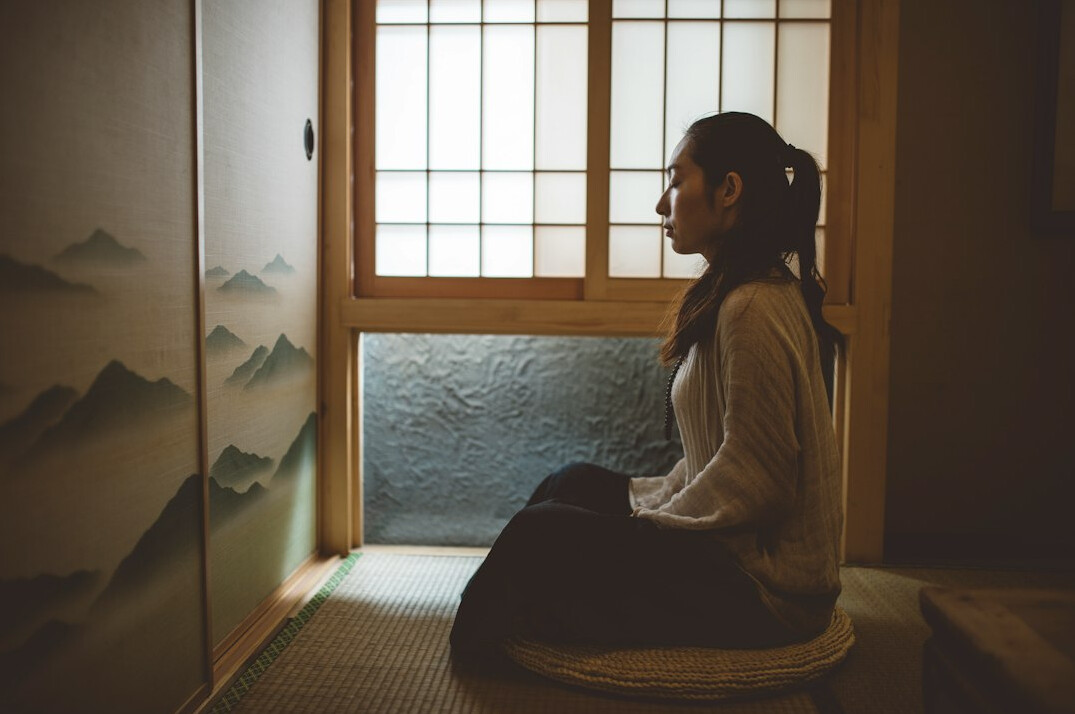 woman meditating outdoors