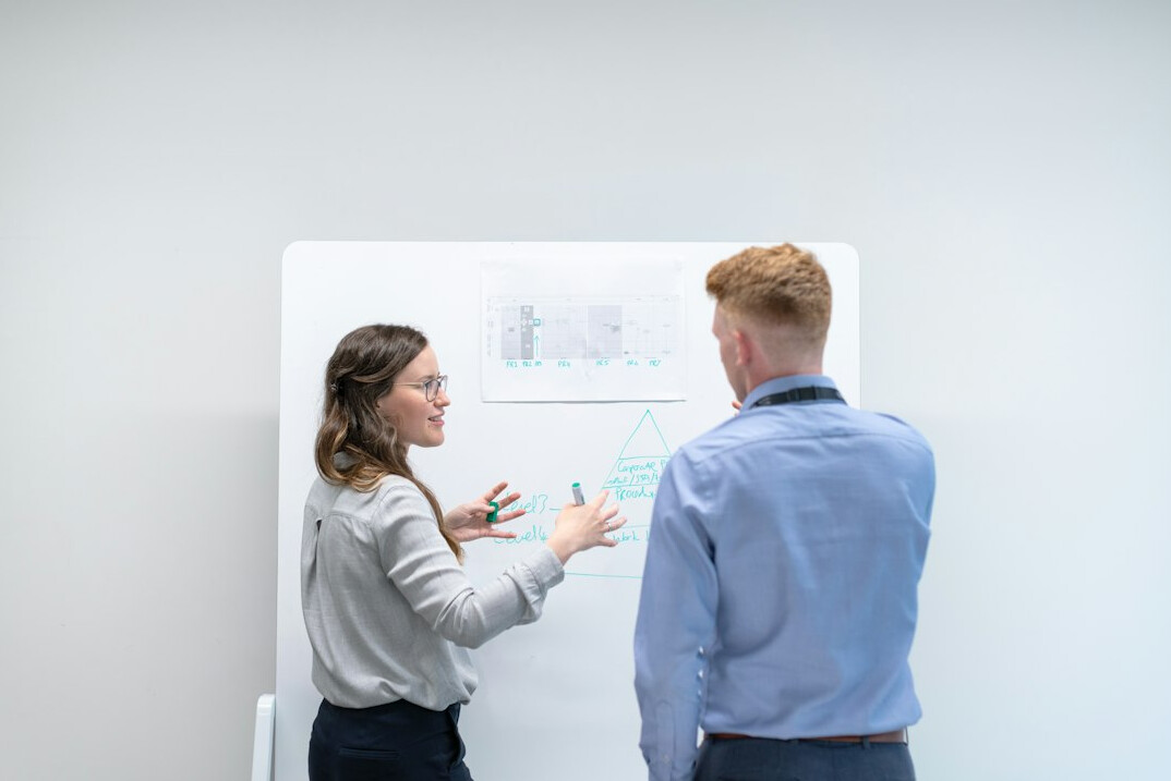 woman presenting in business meeting